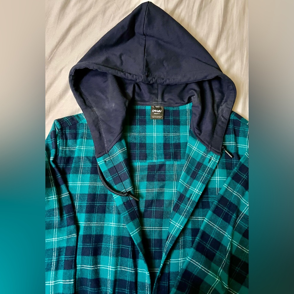 Oakley’s women’s size large teal green, and navy blue plaid lightweight flannel